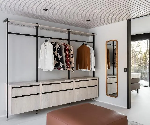 Modern wardrobe with hanging clothes