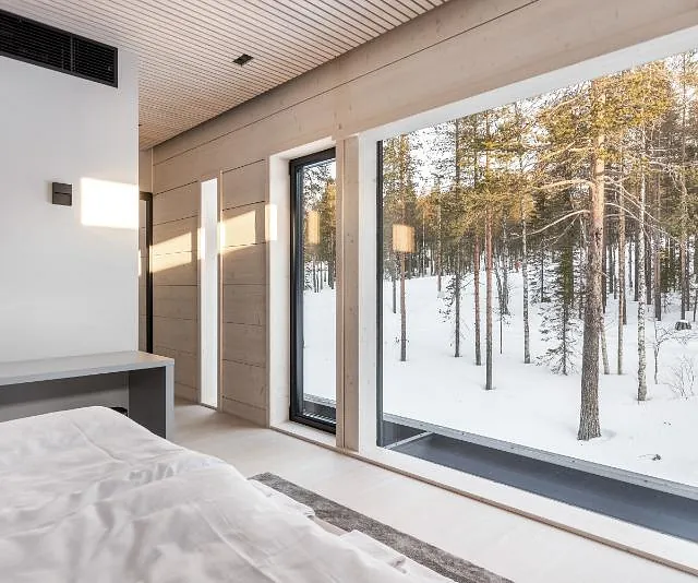 Modern bedroom with snowy view